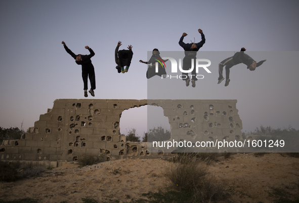 Palestinian youths from Gaza Parkour team, practice their Parkour skills in cemeteries in KhanYounis City, southern Gaza Strip, on February...