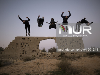 Palestinian youths from Gaza Parkour team, practice their Parkour skills in cemeteries in KhanYounis City, southern Gaza Strip, on February...