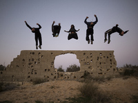 Palestinian youths from Gaza Parkour team, practice their Parkour skills in cemeteries in KhanYounis City, southern Gaza Strip, on February...