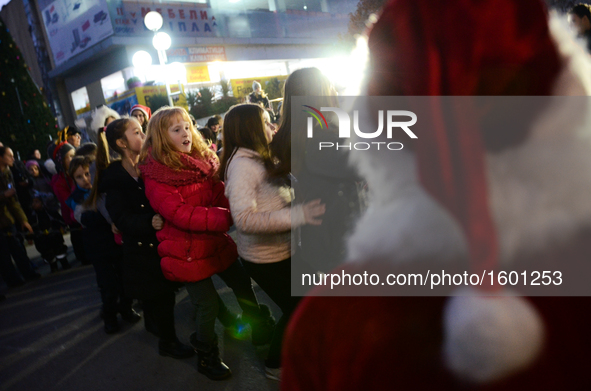 Children having fun at Christmas party with Santa Clause at te centre of the Bulgarian border town of Svilengrad, which is located, some 260...