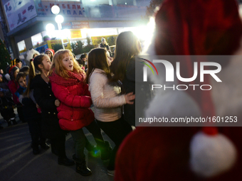 Children having fun at Christmas party with Santa Clause at te centre of the Bulgarian border town of Svilengrad, which is located, some 260...