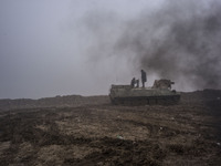 Syrian People's Protection Units (YPG) members in a tank in frontline of Raqqa, on January 7, 2016 fight against the Daesh. (