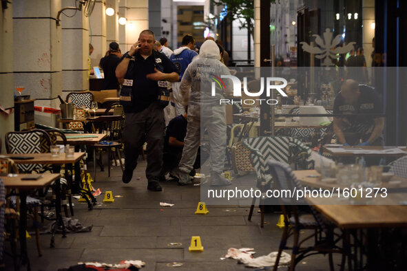 Policemen are investigating the scene of a shooting attack in Sarona Market, Tel-Aviv on June 08'th, 2016. Four Israelis were killed and and...