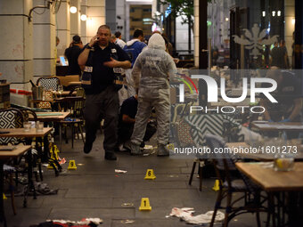 Policemen are investigating the scene of a shooting attack in Sarona Market, Tel-Aviv on June 08'th, 2016. Four Israelis were killed and and...