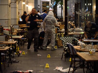 Policemen are investigating the scene of a shooting attack in Sarona Market, Tel-Aviv on June 08'th, 2016. Four Israelis were killed and and...