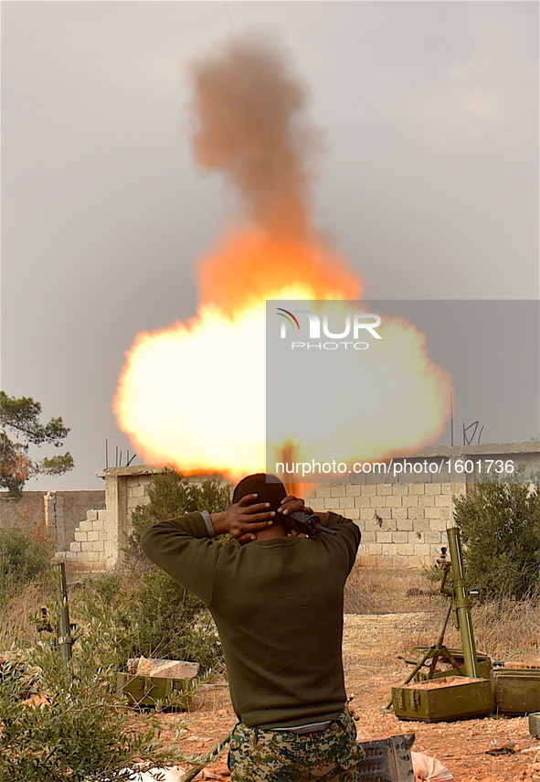 A soldier of pro-government militia fires mortar to rebel-held areas in Aleppo, Syria, on Dec. 11, 2016. The Syrian army and allied fighters...