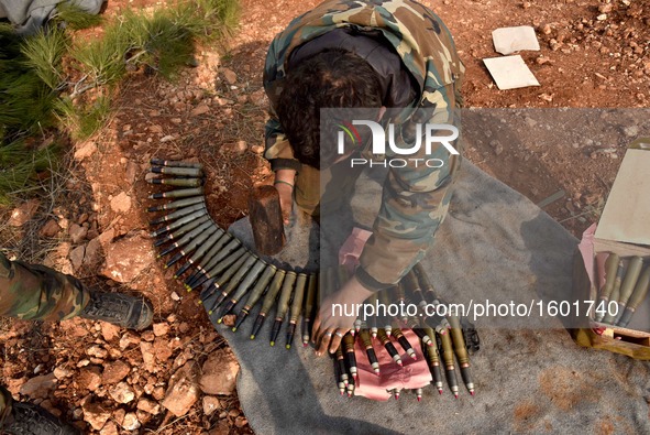 A soldier of pro-government militia prepares ammunition in Aleppo, Syria, on Dec. 11, 2016. The Syrian army and allied fighters are now in c...