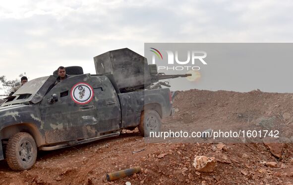 Soldiers of pro-government militia fire to rebel-held areas in Aleppo, Syria, on Dec. 11, 2016. The Syrian army and allied fighters are now...