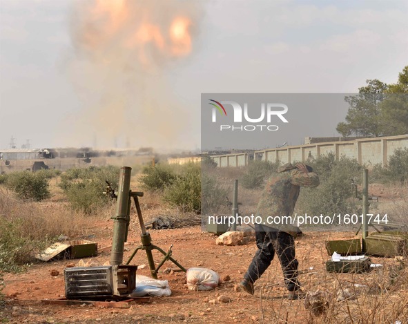 A soldier of pro-government militia fires mortar to rebel-held areas in Aleppo, Syria, on Dec. 11, 2016. The Syrian army and allied fighters...