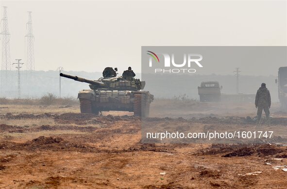 A tank of pro-government local militia marches in a camp of Aleppo, Syria, on Dec. 11, 2016. The Syrian army and allied fighters are now in...