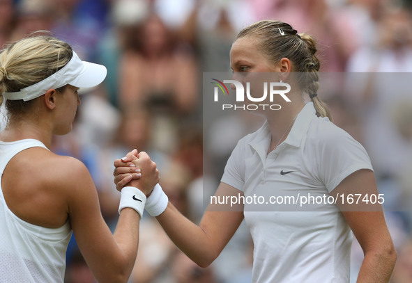 (140705) -- LONDON, July 5, 2014 () -- Czech Republic's Petra Kvitova (R) greets Canada's Eugenie Bouchard after the women's singles final m...