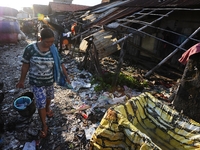 Nurtinah walks for bathing after work as a scavenger.
Nurtinah, 47, a farm worker from Pucang Anom village, Cerme sub-district, Bondowoso di...