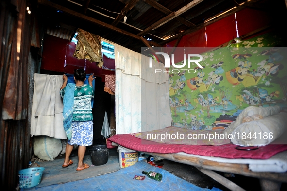 General view of Nurtinah's small hut.
Nurtinah, 47, a farm worker from Pucang Anom village, Cerme sub-district, Bondowoso district, East Jav...