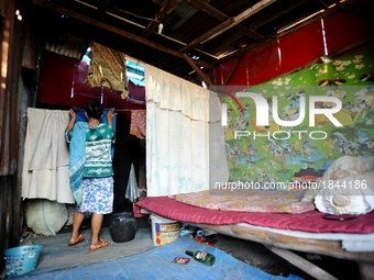 General view of Nurtinah's small hut.
Nurtinah, 47, a farm worker from Pucang Anom village, Cerme sub-district, Bondowoso district, East Jav...