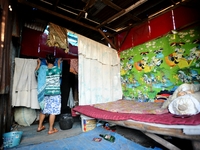 General view of Nurtinah's small hut.
Nurtinah, 47, a farm worker from Pucang Anom village, Cerme sub-district, Bondowoso district, East Jav...