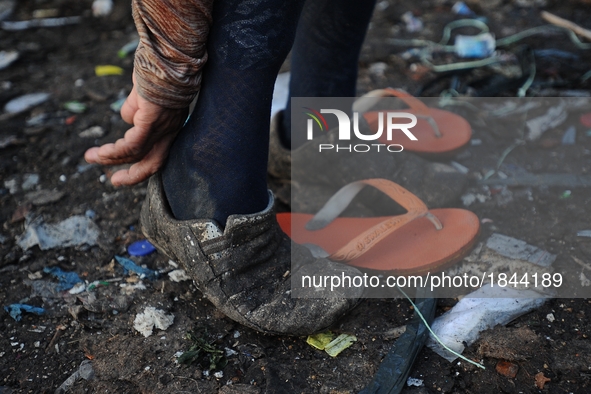 Nurtinah prepares to work as a scavenger.
Nurtinah, 47, a farm worker from Pucang Anom village, Cerme sub-district, Bondowoso district, East...