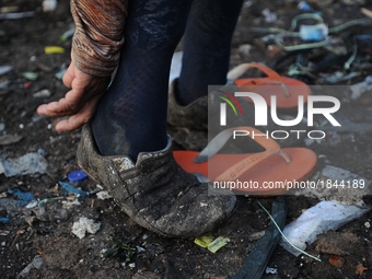 Nurtinah prepares to work as a scavenger.
Nurtinah, 47, a farm worker from Pucang Anom village, Cerme sub-district, Bondowoso district, East...