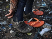 Nurtinah prepares to work as a scavenger.
Nurtinah, 47, a farm worker from Pucang Anom village, Cerme sub-district, Bondowoso district, East...