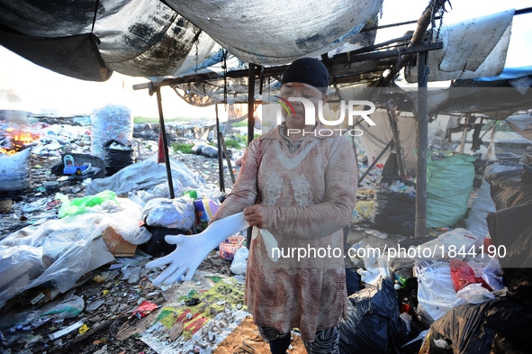 Nurtinah prepares to work as a scavenger.
Nurtinah, 47, a farm worker from Pucang Anom village, Cerme sub-district, Bondowoso district, East...