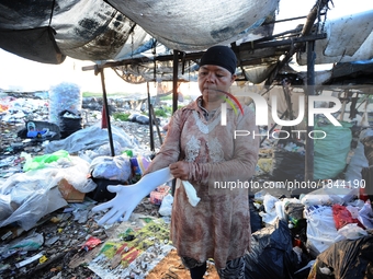 Nurtinah prepares to work as a scavenger.
Nurtinah, 47, a farm worker from Pucang Anom village, Cerme sub-district, Bondowoso district, East...