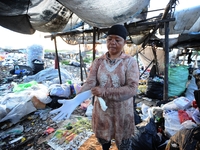 Nurtinah prepares to work as a scavenger.
Nurtinah, 47, a farm worker from Pucang Anom village, Cerme sub-district, Bondowoso district, East...