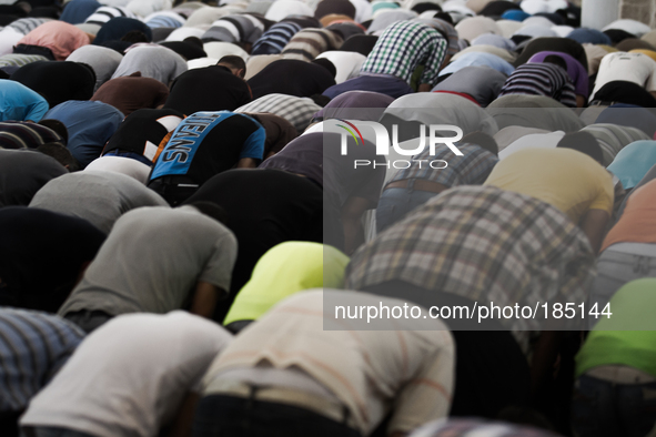 Men praying inside the Great Mosque of Gaza in Gaza City on July 18th, 2014.