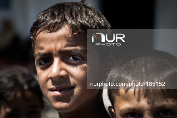 A young boy at a make-shift refugee camp in Jabalya, Gaza on July 18th, 2014. The former school currently holds approximately 3500 Palestini...