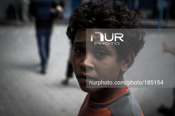 A young boy at a make-shift refugee camp in Jabalya, Gaza on July 18th, 2014. The former school currently holds approximately 3500 Palestini...