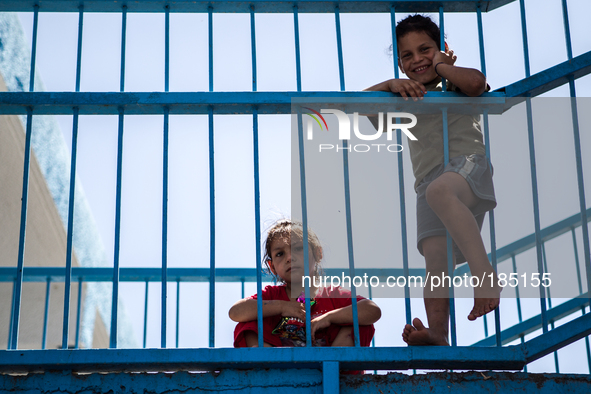 Two children at a make-shift refugee camp in Jabalya, Gaza on July 18th, 2014. The former school currently holds approximately 3500 Palestin...