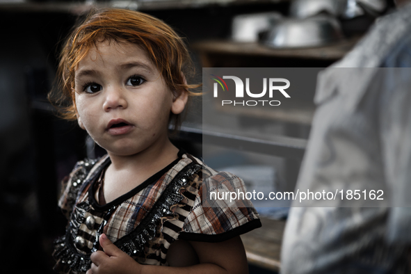 A little Palestinian girl in a make-shift refugee camp in Jabalya, Gaza on July 18th, 2014. The former school currently holds approximately...