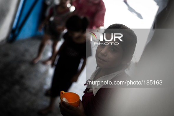 A young  in a make-shift refugee camp in Jabalya, Gaza on July 18th, 2014. The former school currently holds approximately 3500 Palestinian....