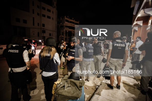 Journalists gather in front of Al Deira hotel after most of the so called Beach Hotels in Gaza city had to be evacuated prior to the beginni...