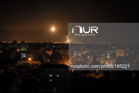 Israeli Defense Forces (IDF) firing flares to illuminate the landscape during the second night of the ground invasion on July 19th, 2014.