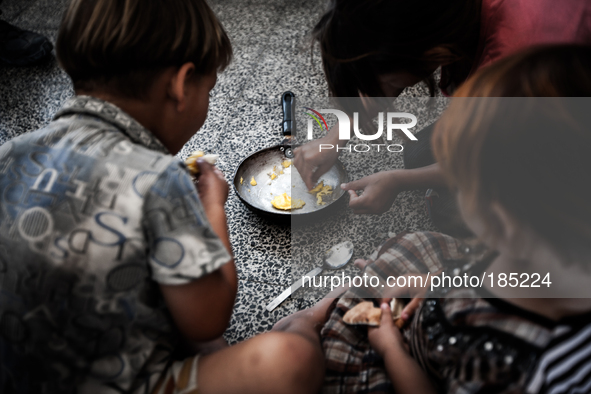 Children eating in a make-shift refugee camp in Jabalya, Gaza on July 18th, 2014. The former school currently holds approximately 3500 Pales...