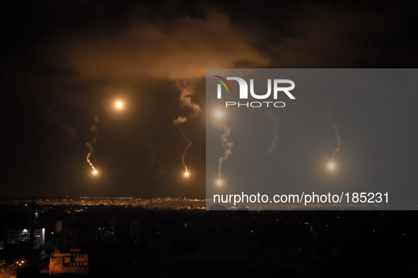 Israeli Defense Forces (IDF) firing flares to illuminate the landscape during the second night of the ground invasion on July 19th, 2014.