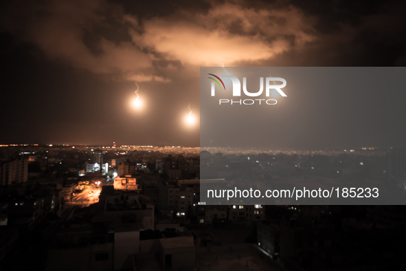 Israeli Defense Forces (IDF) firing flares to illuminate the landscape during the second night of the ground invasion on July 19th, 2014.