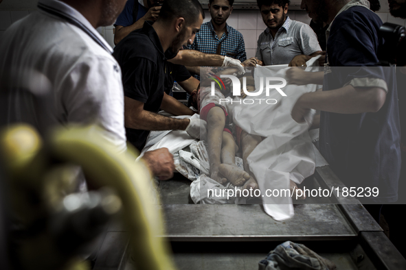 The dead bodies of two children (5 and 9 years) that died during tank shelling in the morning hours of July 20th inside the Central Morgue o...