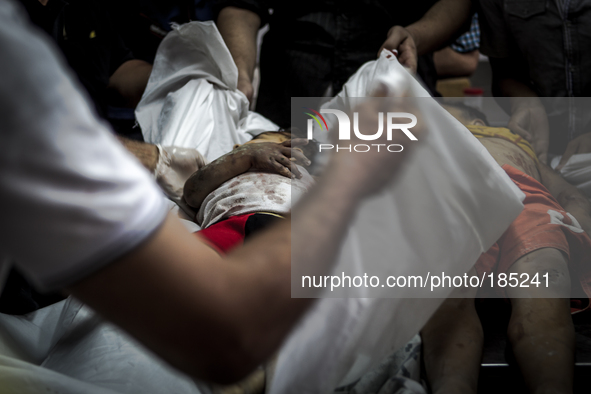 The dead bodies of two children (5 and 9 years) that died during tank shelling in the morning hours of July 20th inside the Central Morgue o...