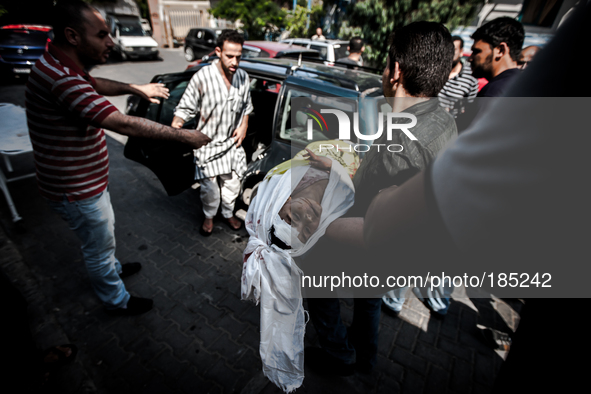 The dead body of a boy (5 years) that has been killed by Israeli tank shells in Gaza City is being carried to the funeral on July 20th, 2014...