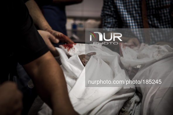 The dead bodies of two children (5 and 9 years) that died during tank shelling in the morning hours of July 20th inside the Central Morgue o...