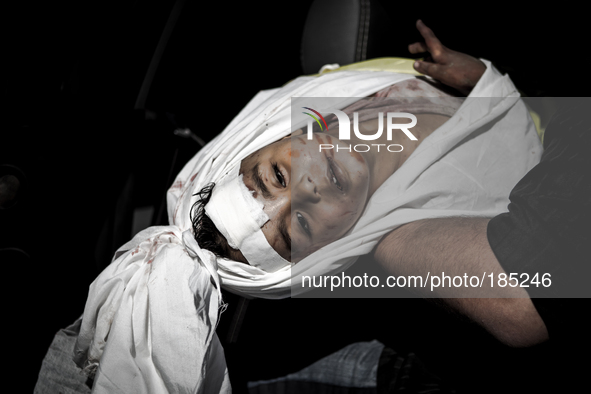 The dead body of a boy (5 years) that has been killed by Israeli tank shells in Gaza City is being carried to the funeral on July 20th, 2014...