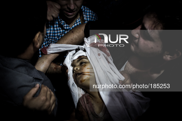 The dead body of a boy (5 years) that has been killed by Israeli tank shells in Gaza City is being carried to the funeral on July 20th, 2014...