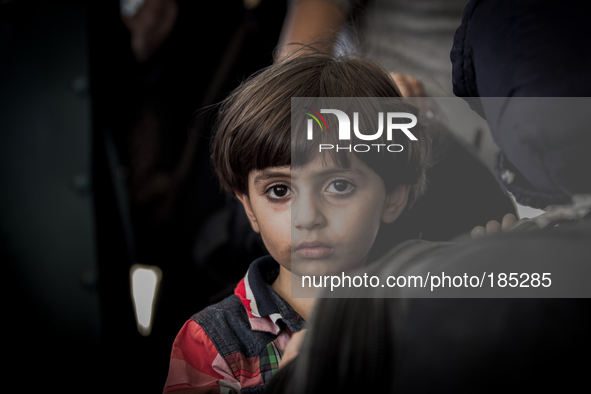 A young boy and his family from Gaza City are waiting for hours in front of the Israeli border crossing at Erez on July 20th, 2014 to escape...