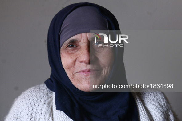 Syrian Umm Mohammed, poses for a picture at her home in the rebel-held town of Douma, on the outskirts of the capital Damascus, on March 25,...