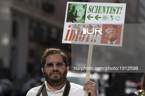 A protester holds a anti-Trump sign during the March for Science in Los Angeles, California on April 22, 2017. The event which coincides wit...