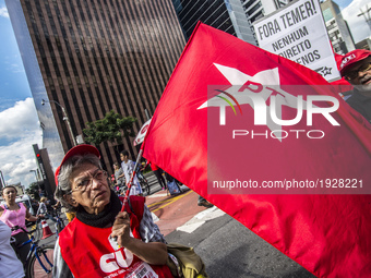 People take part in the Labour Day march held in downtown São Paulo, Brazil, on 01 May 2017. Labor Day or May Day is observed all over the w...