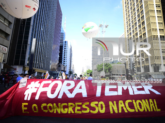 People take part in the Labour Day march held in downtown São Paulo, Brazil, on 01 May 2017. Labor Day or May Day is observed all over the w...