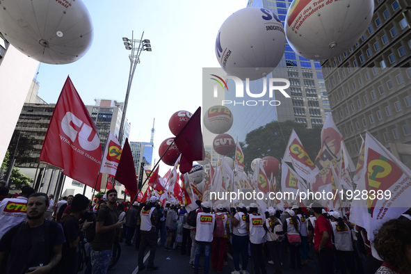 People take part in the Labour Day march held in downtown São Paulo, Brazil, on 01 May 2017. Labor Day or May Day is observed all over the w...