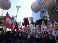 People take part in the Labour Day march held in downtown São Paulo, Brazil, on 01 May 2017. Labor Day or May Day is observed all over the w...