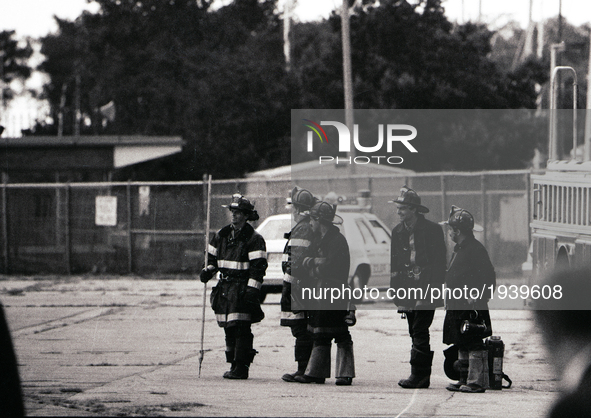 Firefighters attends the arrival of US President Ronald Reagan in Chicago on September 1984.